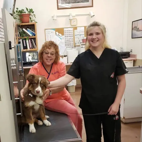 Staff members with dog
